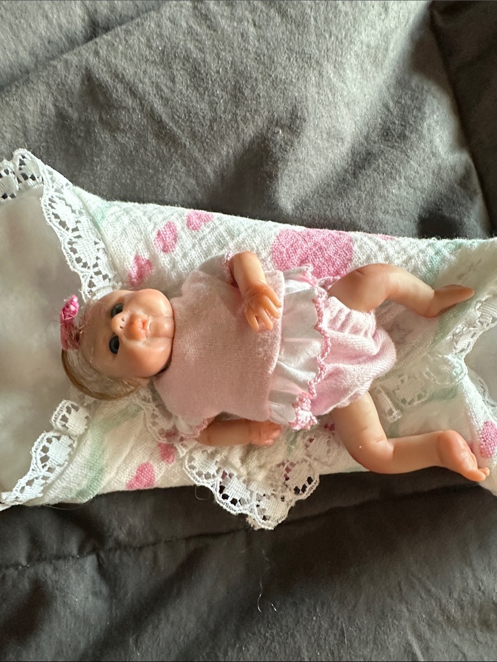 Tiny handmade clay, baby. Beautiful outfit & bed. Adorable.